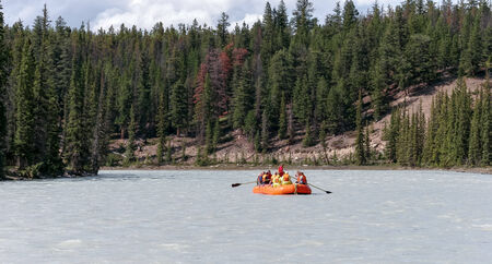 JASPER, ALBERTA/CANADA - AUGUST 9 : Whitewater rafting on the Athabasca river flowing down to Jasper on August 9, 2007. Unidentified people.のeditorial素材