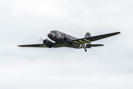 Douglas C-47A Skytrain "Drag 'em oot" N473DC flying over Shoreham Airfieldのeditorial素材