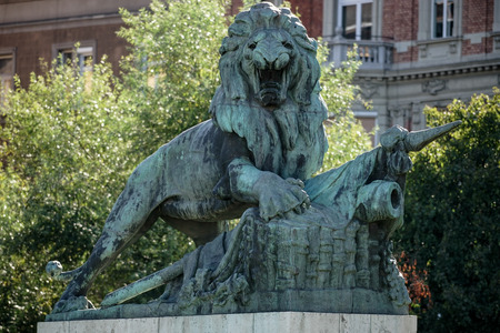 Statue of a Lion guarding the Margaret Bridge in Budapestの写真素材