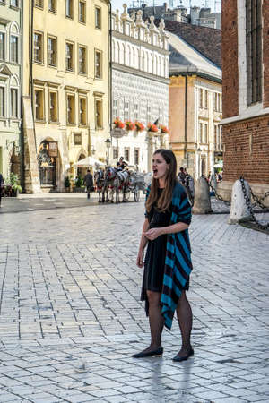 Woman singing in the street in Krakowのeditorial素材