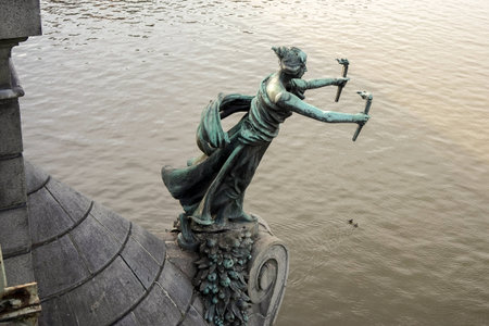 Statue of a woman with torches on the Cechuv Bridge in Pragueのeditorial素材