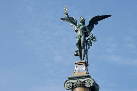 Angel on top of a column on the Cechuv Most Bridge in Pragueの写真素材