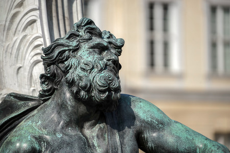 One of the four chained warriors at the base of King Frederic the Great statue Charlottenburg Palace in Berlinの写真素材