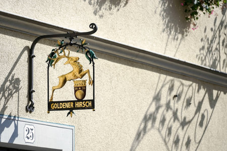 Hotel Goldener Hirsch hanging sign in Rothenburgのeditorial素材