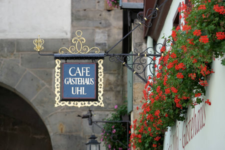 Cafe Gatehaus UHL hanging sign in Rothenburgのeditorial素材