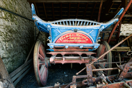 Old wooden cart in a barn at St Fagans National History Museumのeditorial素材