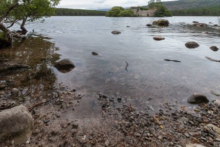 Castle in the middle of Loch an Eilein near Aviemore Scotlandの写真素材
