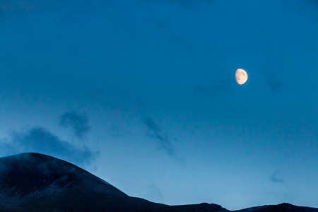 Moon rising over the Cairngorm mountainsの写真素材