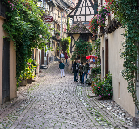 Tourists exploring Eguisheim in Haut-Rhin Alsace Franceのeditorial素材