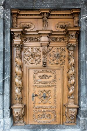 Wooden carved door St. Theodul Church in Sachseln Obwalden in Switzerlandの写真素材