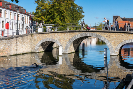 Bridge over a canal in Bruges West Flanders in Belgiumのeditorial素材
