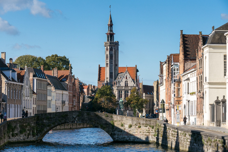 View down a canal in Bruges West Flanders in Belgiumのeditorial素材