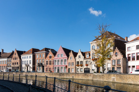 Buildings alongside a canal in Bruges West Flanders in Belgiumのeditorial素材