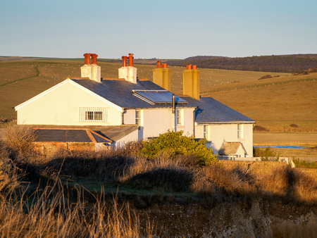 Old Coastguard Cottages at Seaford Headのeditorial素材