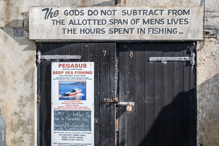 Quotation on a Garage Door at Lyme Regis Harbourのeditorial素材