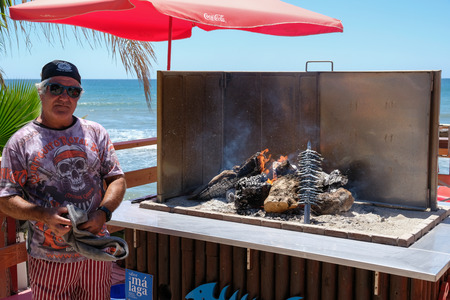 CALAHONDA, ANDALUCIA/SPAIN - JULY 2 : Man Cooking Sardines on the Beach at Calahonda Costa del Sol Spain on July 2, 2017. Unidentified manのeditorial素材