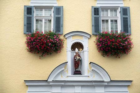 Statue of a Bishop on a Wall in St Wolfgangの写真素材