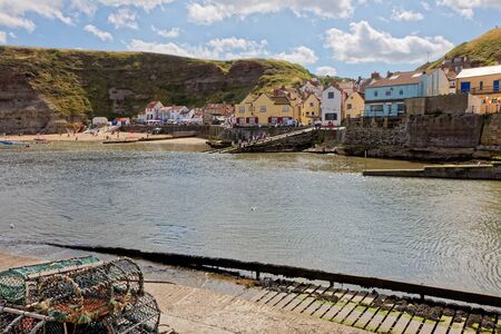 STAITHES, NORTH YORKSHIRE/UK - AUGUST 21 : View of Staithes Harbour North Yorkshire on August 21, 2010. Unidentified peopleのeditorial素材