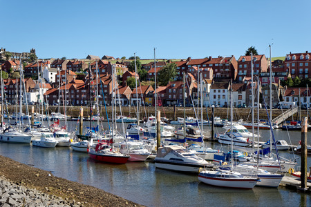 WHITBY, NORTH YORKSHIRE/UK - AUGUST 22 : View along the Esk towards Whitby North Yorkshire on August 22, 2010. Unidentified peopleのeditorial素材