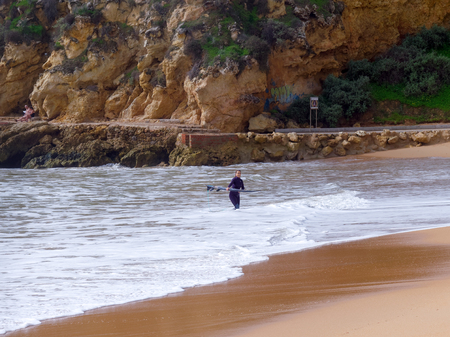 ALBUFEIRA, SOUTHERN ALGARVE/PORTUGAL - MARCH 10 : View of the Beach at Albufeira in Portugal on March 10, 2018. Unidentified peopleのeditorial素材