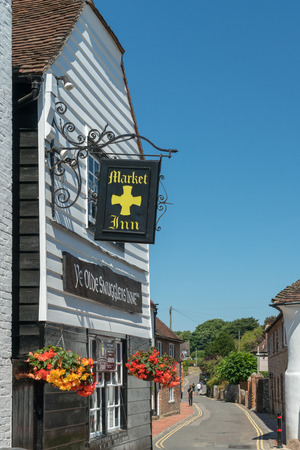 ALFRISTON, SUSSEX/UK - JULY 23 : View of the Market Inn at Alfriston Sussex on July 23, 2018. Three unidentified peopleのeditorial素材