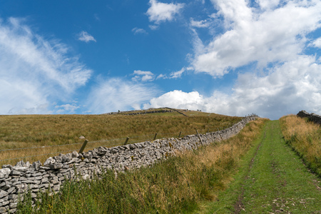 View along a grass track near Ingleton in Yorkshireの写真素材