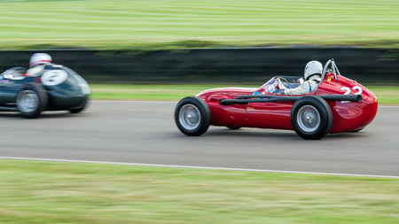 GOODWOOD, WEST SUSSEX/UK - SEPTEMBER 14 : Vintage Racing at Goodwood at Goodwood on September 14, 2012. Two unidentified peopleのeditorial素材