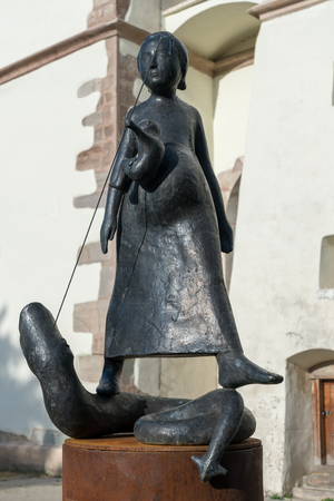 BISTRITA, TRANSYLVANIA/ROMANIA - SEPTEMBER 17 : Modern sculpture in front of the Lutheran Church in Bistrita Transylvania Romania on September 17, 2018のeditorial素材