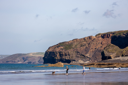 BROAD HAVEN, PEMBROKESHIRE/UK - SEPTEMBER 14 : People enjoying the beach at Broad Haven Pembrokeshire on September14, 2019. Unidentified peopleのeditorial素材