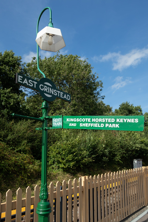EAST GRINSTEAD, WEST SUSSEX/UK - AUGUST 30 : Lamp post and direction sign at East Grinstead station West Sussex on August 30, 2019のeditorial素材