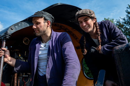 EAST GRINSTEAD, WEST SUSSEX/UK - AUGUST 30 : Fireman and stoker of steam locomotive in East Grinstead West Sussex on August 30, 2019. Two unidentified peopleのeditorial素材