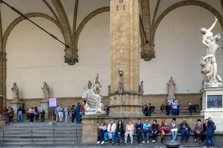 FLORENCE, TUSCANY/ITALY - OCTOBER 19 : Statues and people in the Loggia dei Lanzi in Florence on October 19, 2019. Unidentified peopleのeditorial素材