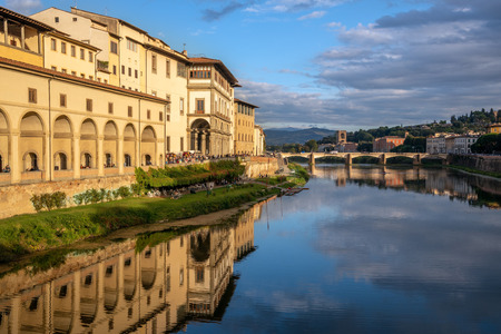 FLORENCE, TUSCANY/ITALY - OCTOBER 18 : View of buildings along and across the River Arno in Florence  on October 18, 2019. Unidentified people.のeditorial素材