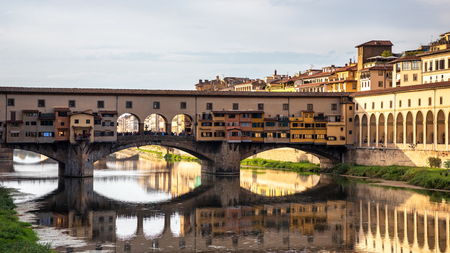 FLORENCE, TUSCANY/ITALY - OCTOBER 18 : View of buildings along and across the River Arno in Florence  on October 18, 2019. Unidentified people.のeditorial素材