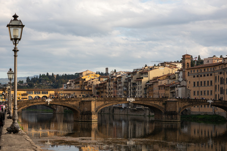 FLORENCE, TUSCANY/ITALY - OCTOBER 18 : View of buildings along and across the River Arno in Florence  on October 18, 2019. Unidentified people.のeditorial素材