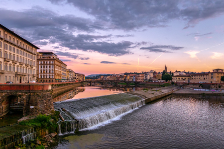 FLORENCE, TUSCANY/ITALY - OCTOBER 19 : View of buildings along the River Arno at dusk  in Florence  on October 19, 2019. Unidentified peopleのeditorial素材