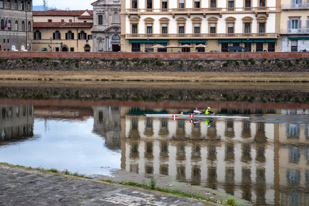 FLORENCE, TUSCANY/ITALY - OCTOBER 20 : View of buildings along and across the River Arno in Florence  on October 20, 2019. Unidentified people.のeditorial素材