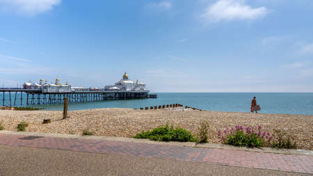 EASTBOURNE, EAST SUSSEX/UK - JUNE 16 : View of Eastbourne Pier in East Sussex on June 16, 2020. One unidentified womanのeditorial素材