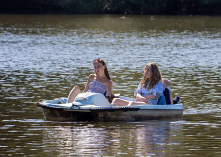 EARLSWOOD, SURREY/UK - JULY 31 : Enjoying a pedallo on Earlswood Lake Surrey on July 31, 2020. Three unidentified peopleのeditorial素材