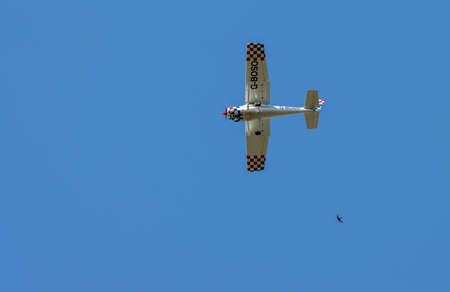 EARLSWOOD, SURREY/UK - JULY 31 : Light plane G-BOSO - Cessna A152 Aerobat flying over Earlswood Surrey on July 31, 2020のeditorial素材