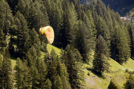 SELVA, SOUTH TYROL/ITALY - AUGUST 8 : Paragliding in the Dolomites near Selva, South Tyrol, Italy on August 8, 2020. Unidentified personのeditorial素材