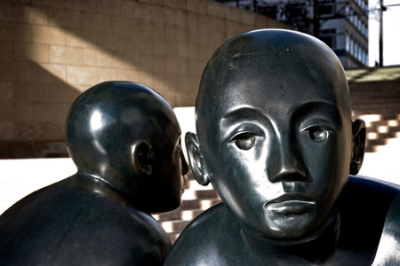 LONDON/UK - FEBRUARY 12 : Giles Pennyâs Two Men on a Bench at Canary Wharf in Docklands London on February 12, 2005のeditorial素材