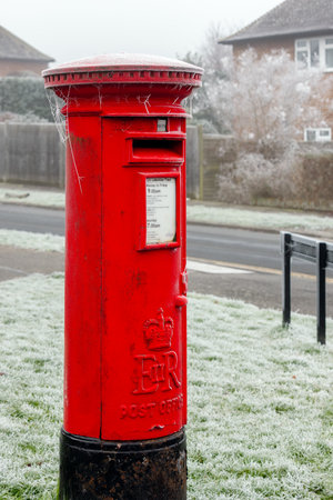 EAST GRINSTEAD, WEST SUSSEX, UK - JANUARY 10 : Hoar frost on a red pillar box in East Grinstead, West Sussex on January 10, 2021のeditorial素材