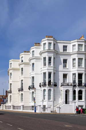 EASTBOURNE, EAST SUSSEX, UK - MAY 3 : View of some apartments in Eastbourne on May 3, 2021. Three unidentified peopleのeditorial素材