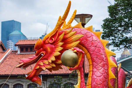 SINGAPORE - FEBRUARY 3 : Large plastic model of a dragon in a street in Singapore on February 3, 2012のeditorial素材
