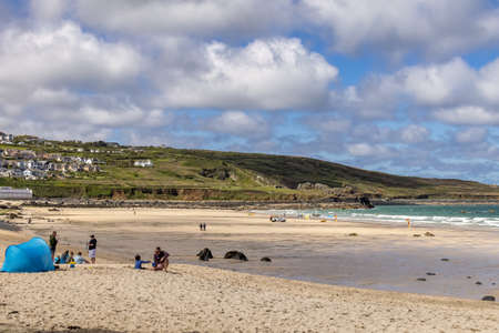 ST IVES, CORNWALL, UK - MAY 13 : View of Porthmeor beach at St Ives, Cornwall on May 13, 2021. Unidentified peopleのeditorial素材