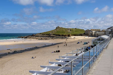 ST IVES, CORNWALL, UK - MAY 13 : View of Porthmeor beach at St Ives, Cornwall on May 13, 2021....