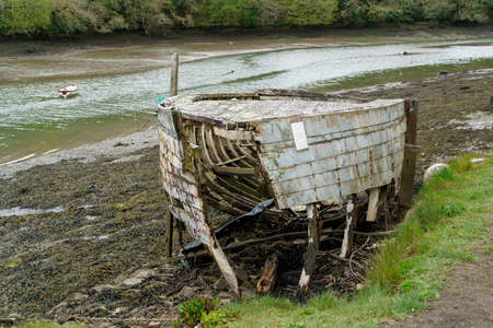 COOMBE, CORNWALL, UK - MAY 12 : Old derelict boat in the creek in Coombe,  Cornwall on May 12, 2021の写真素材