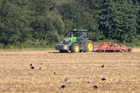 EAST GRINSTEAD, WEST SUSSEX, UK - APRIL 8 : Ploughing a field on a farm near East Grinstead, West...