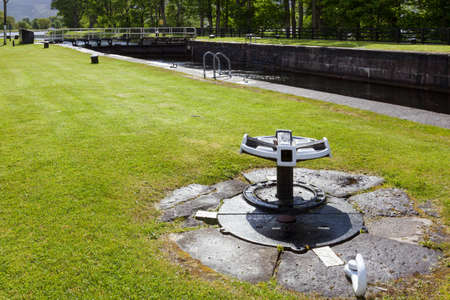 CORPACH, SCOTLAND, UK - MAY 19 : View of the Caledonian Canal at Corpach in Scotland on May 19, 2011. Three unidentified peopleのeditorial素材